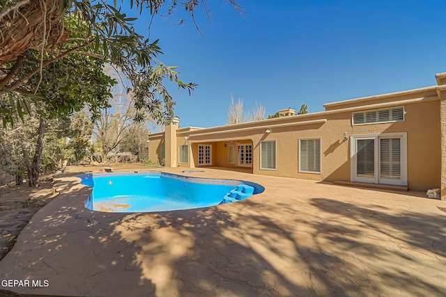 pool featuring a patio area and french doors