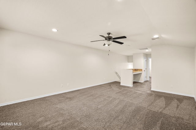 unfurnished living room with carpet flooring, ceiling fan, and lofted ceiling