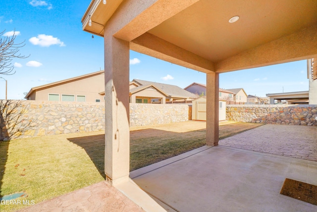 view of patio with a shed