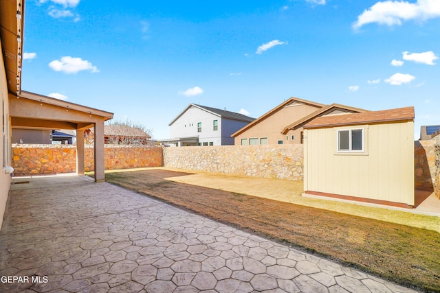 view of patio with a shed