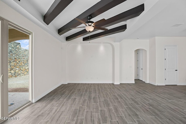 spare room featuring ceiling fan and beam ceiling