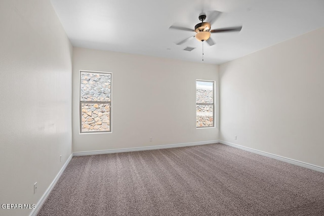 unfurnished room with carpet flooring and ceiling fan