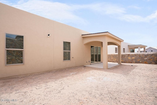 rear view of property with a patio area