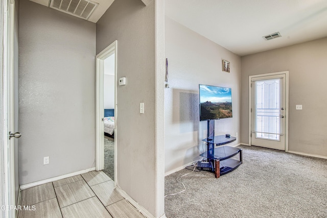 interior space featuring light colored carpet