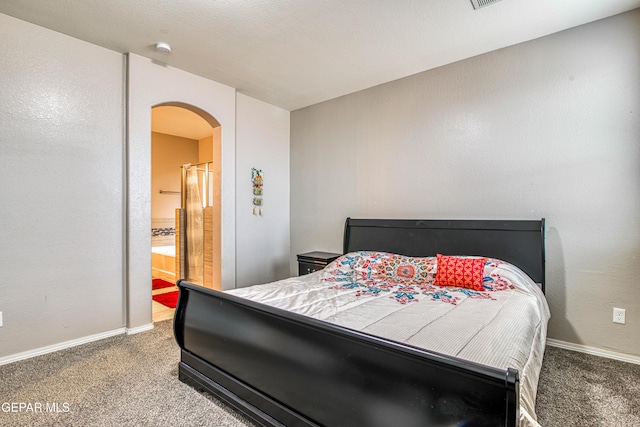 carpeted bedroom featuring connected bathroom