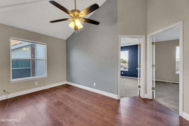 spare room with hardwood / wood-style flooring, ceiling fan, and lofted ceiling