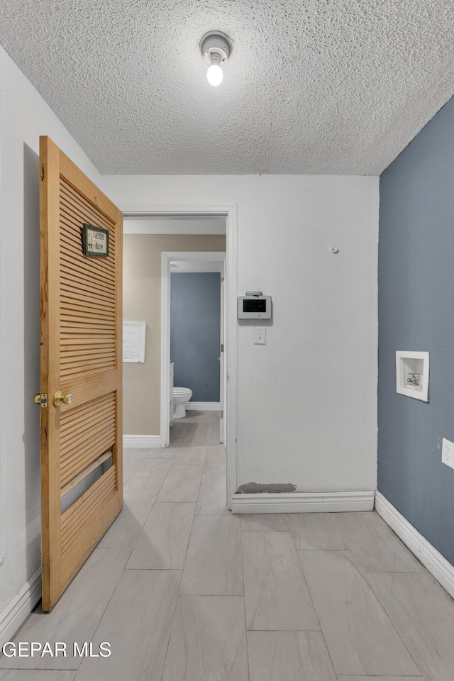 bathroom featuring a textured ceiling