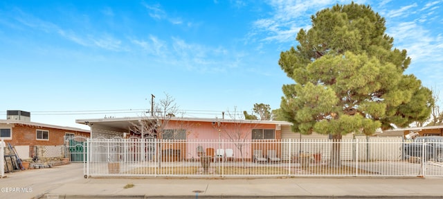 ranch-style home with a carport