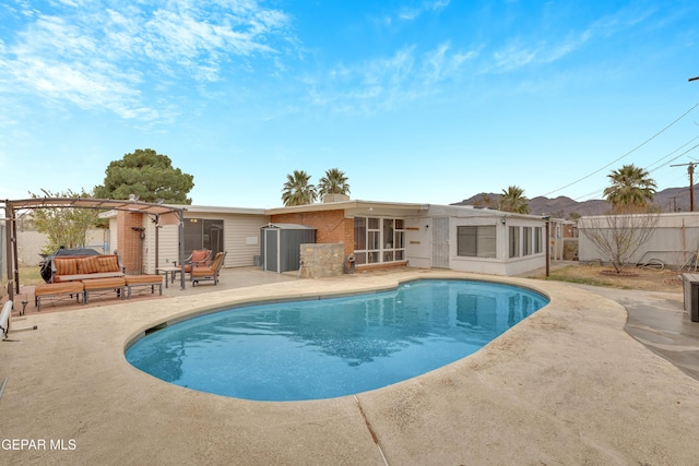 view of pool featuring a patio area and a pergola