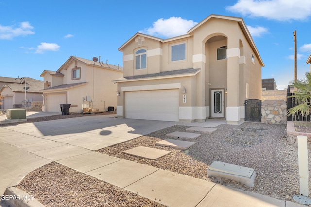 view of front of property with a garage and cooling unit