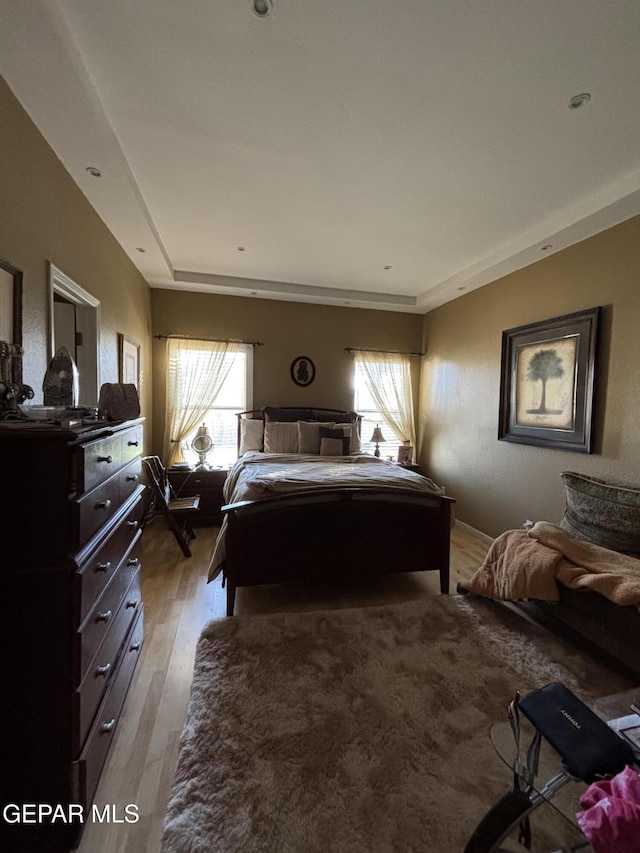 bedroom with light wood-type flooring