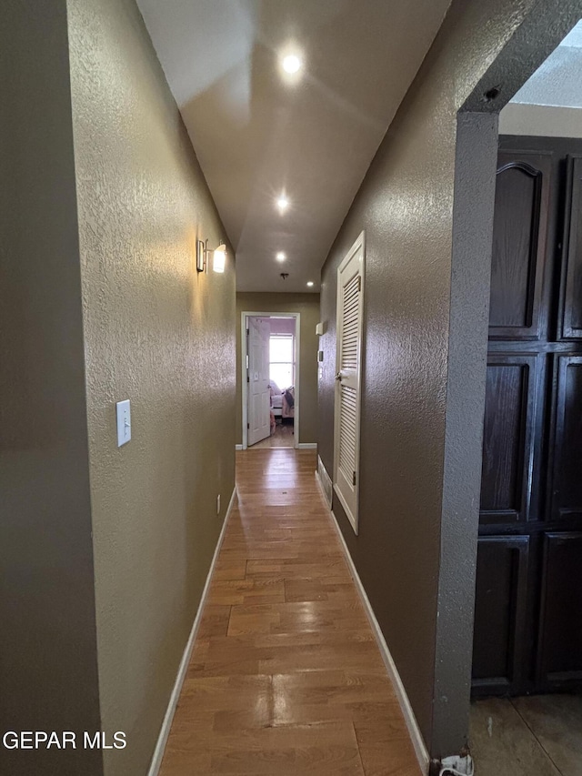 corridor featuring wood-type flooring