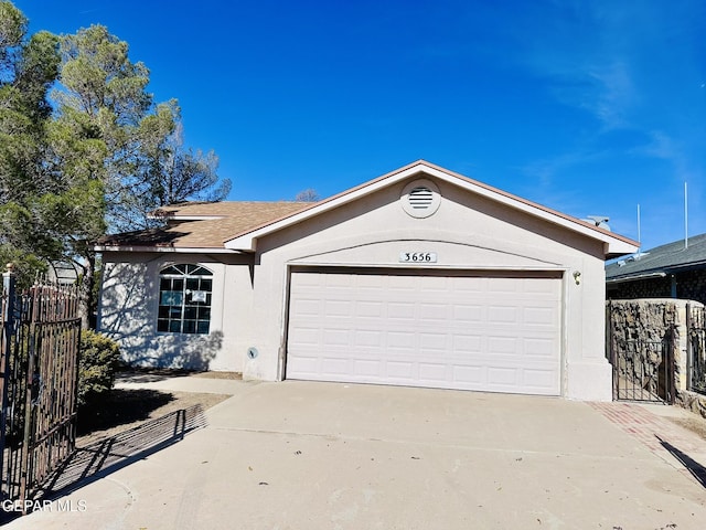 ranch-style home with a garage