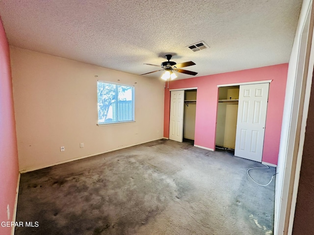 unfurnished bedroom featuring a textured ceiling, carpet floors, and ceiling fan