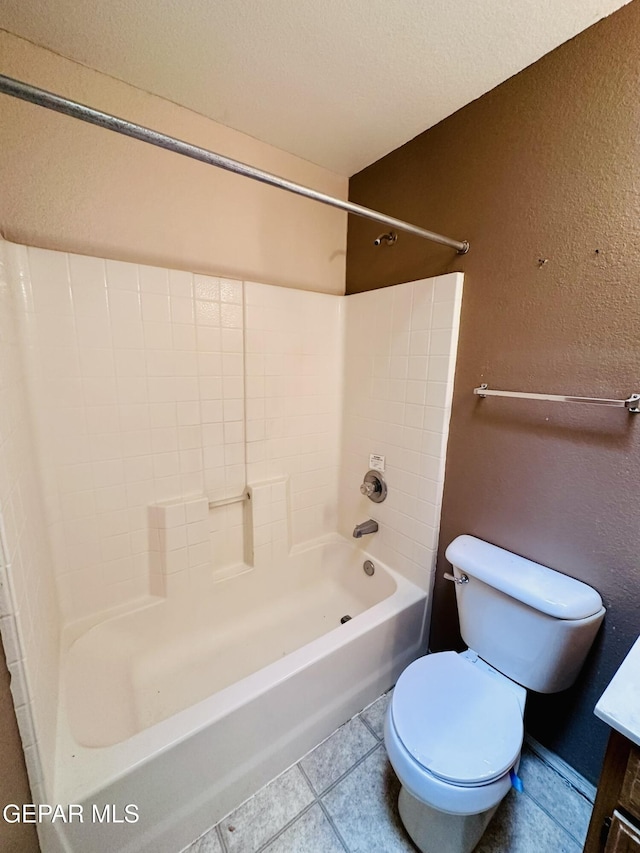 full bathroom featuring tile patterned floors, vanity, toilet, and shower / bath combination