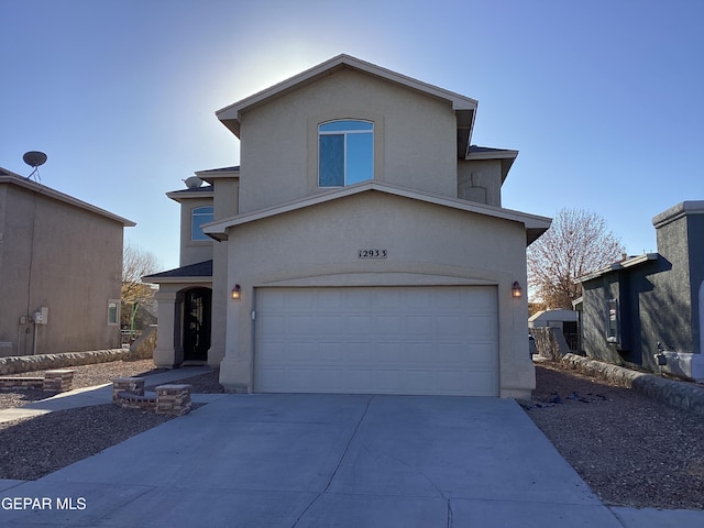 12933 Hidden Grove Dr, El Paso, TX 79938 - traditional-style home with an attached garage, stucco siding, and concrete driveway