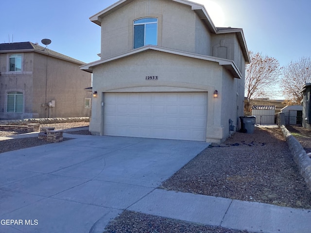 12933 Hidden Grove Dr, El Paso, TX 79938 - view of front of property featuring an attached garage and driveway