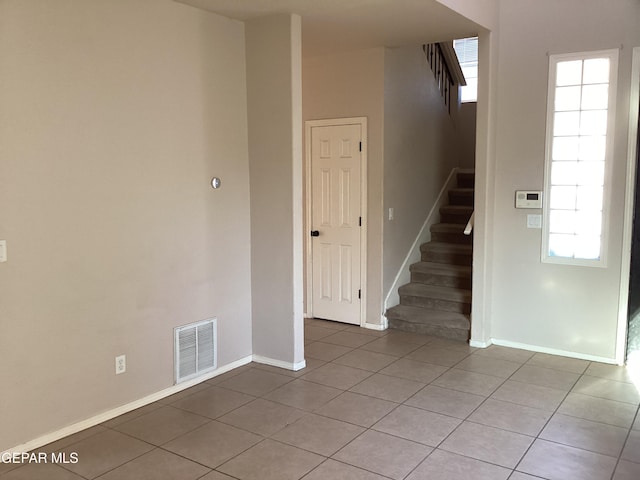 interior space with light tile patterned floors