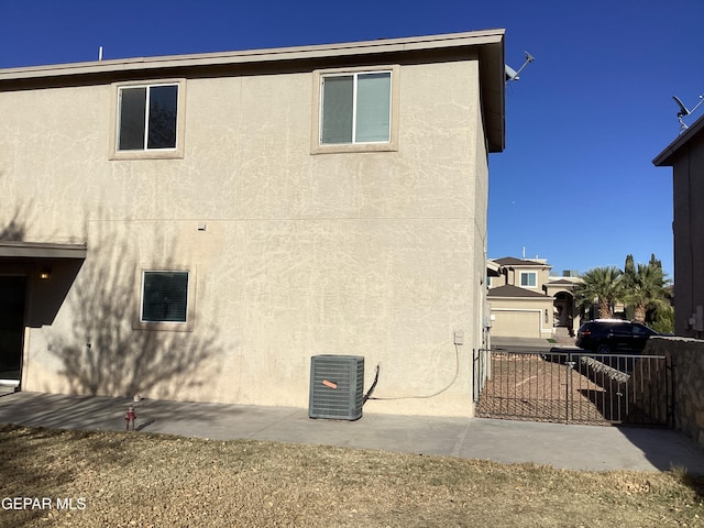 view of home's exterior featuring central air condition unit and a patio