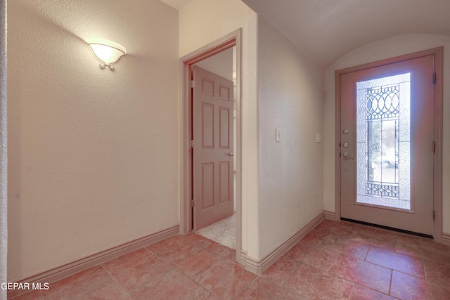 foyer with lofted ceiling