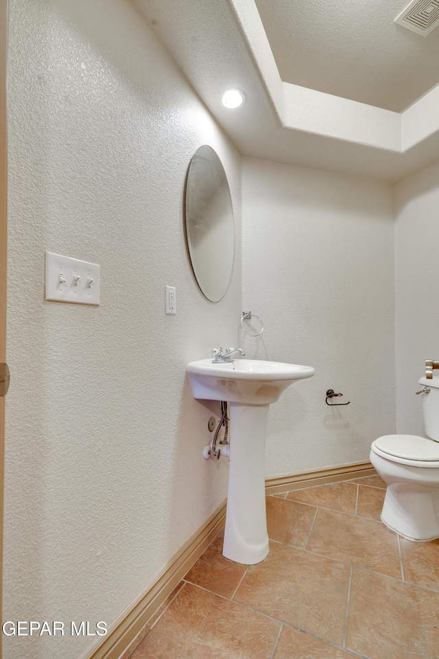 bathroom featuring toilet