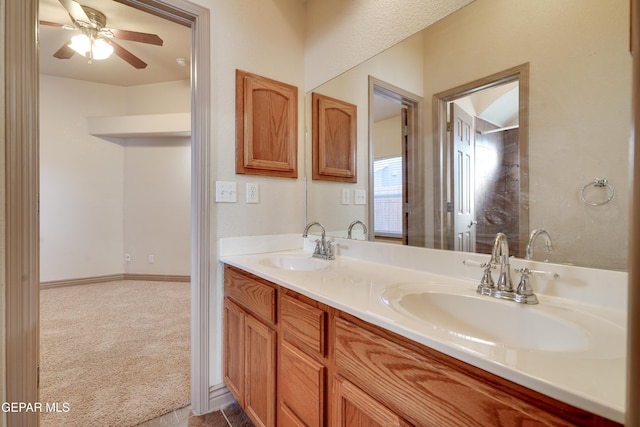 bathroom with ceiling fan and vanity