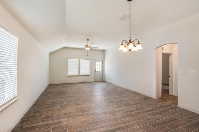 13820 Madero Ave, El Paso, TX 79928 - empty room featuring ceiling fan, arched walkways, dark wood-style flooring, vaulted ceiling, and a chandelier