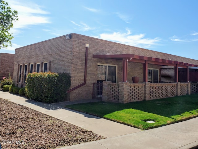 view of property exterior with a lawn