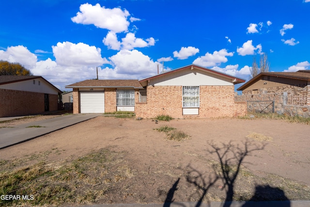 single story home with a garage