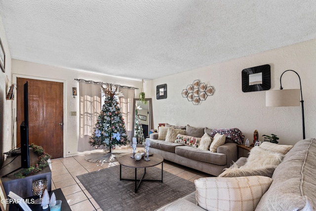 tiled living room featuring a textured ceiling