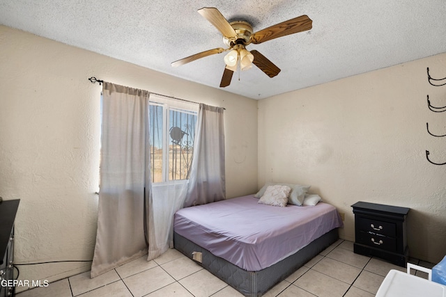 tiled bedroom with ceiling fan, a textured ceiling, and billiards