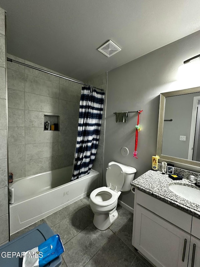 full bathroom featuring tile patterned floors, vanity, toilet, and shower / bathtub combination with curtain