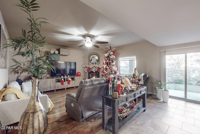 tiled living room featuring ceiling fan