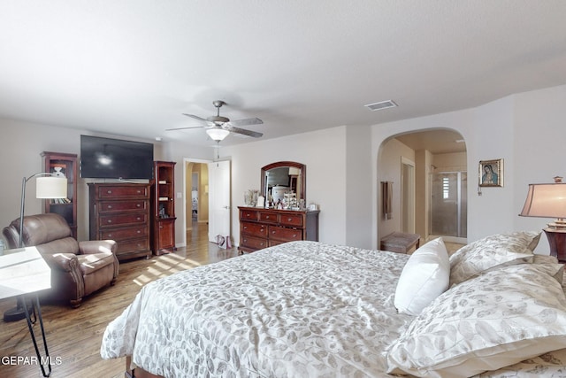 bedroom with light hardwood / wood-style floors and ceiling fan