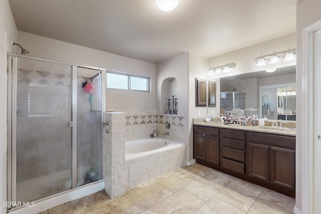 bathroom with tile patterned floors, vanity, and plus walk in shower