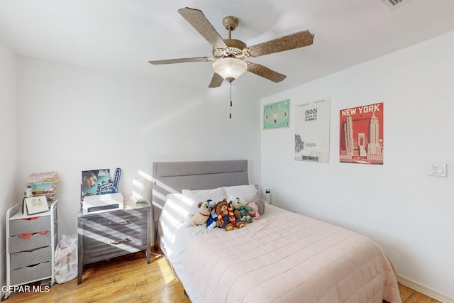 bedroom featuring ceiling fan and light hardwood / wood-style flooring