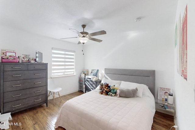 bedroom featuring wood-type flooring and ceiling fan