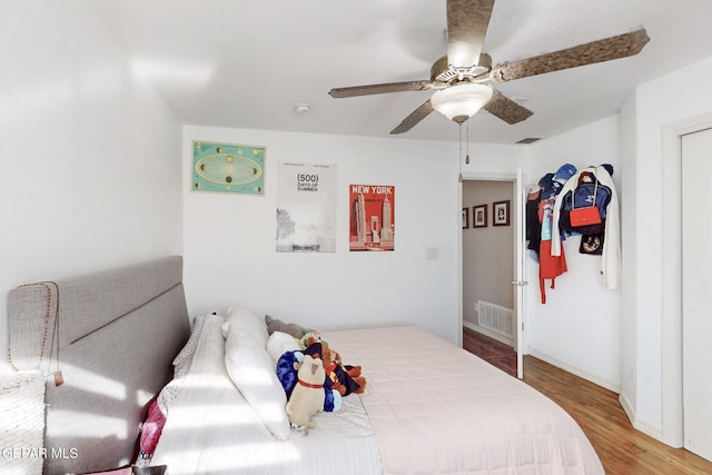 bedroom featuring ceiling fan and hardwood / wood-style floors