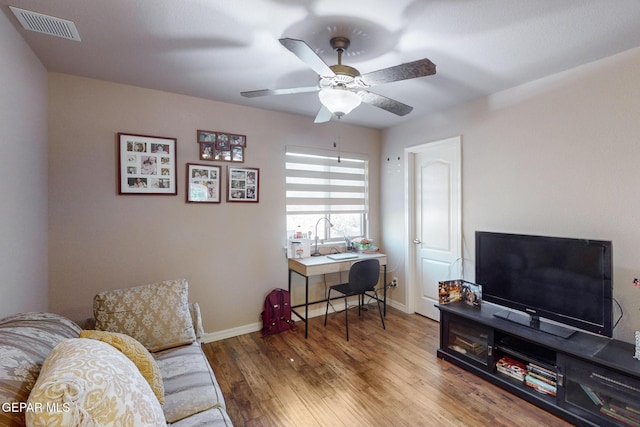 interior space with hardwood / wood-style flooring and ceiling fan