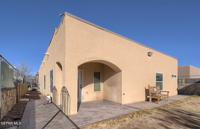 rear view of house featuring a patio area