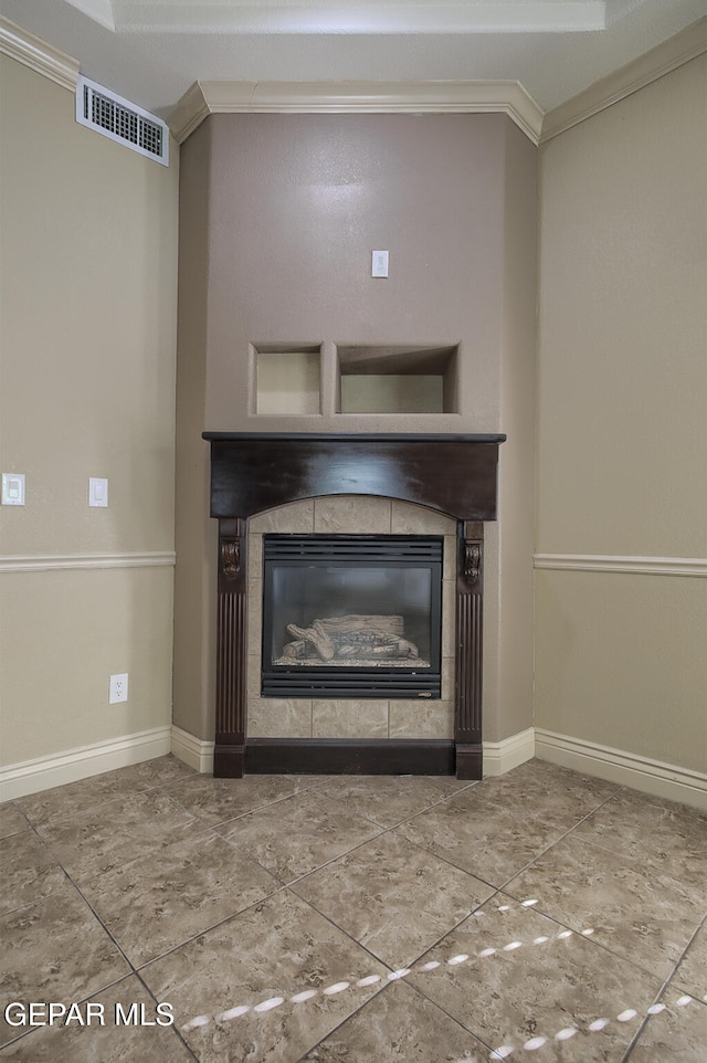 details featuring a tile fireplace and crown molding