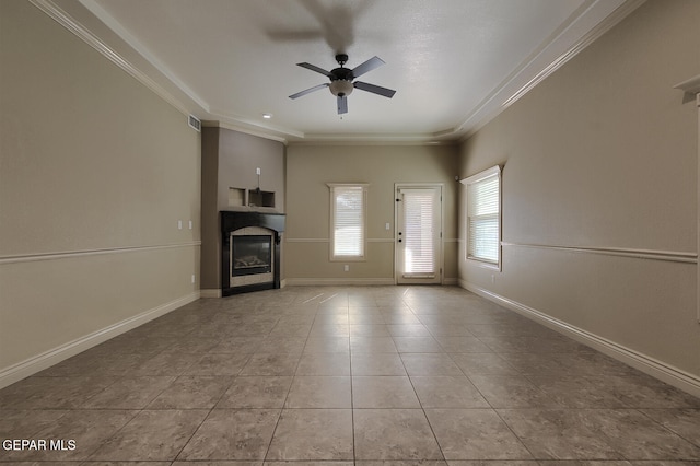 unfurnished living room with crown molding, ceiling fan, and light tile patterned floors