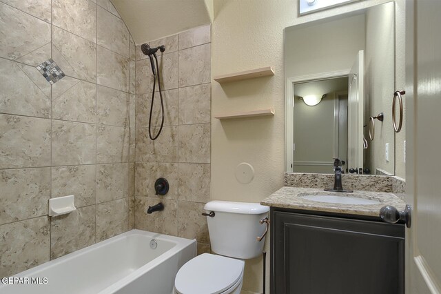 full bathroom featuring vanity, toilet, and tiled shower / bath