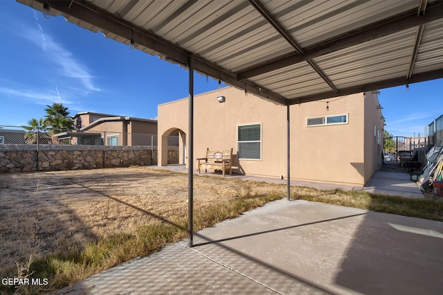 back of house with a patio