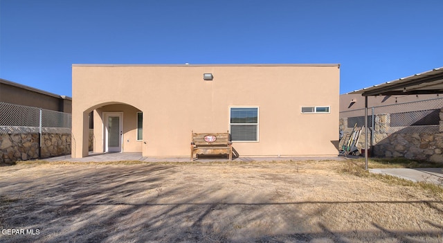 back of house featuring a patio