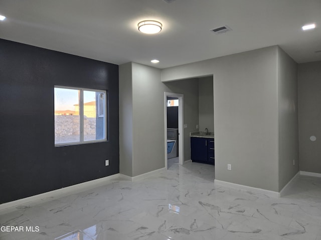 unfurnished room with sink