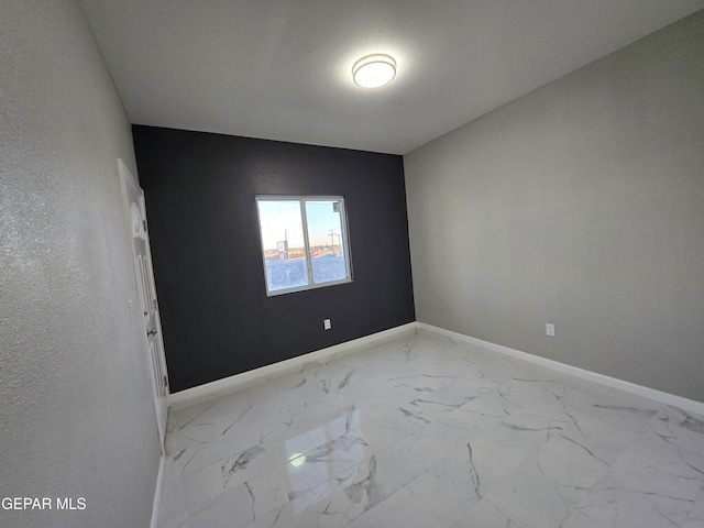 empty room with a textured ceiling