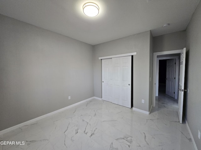 unfurnished bedroom with a closet