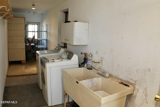 clothes washing area featuring washing machine and clothes dryer and sink