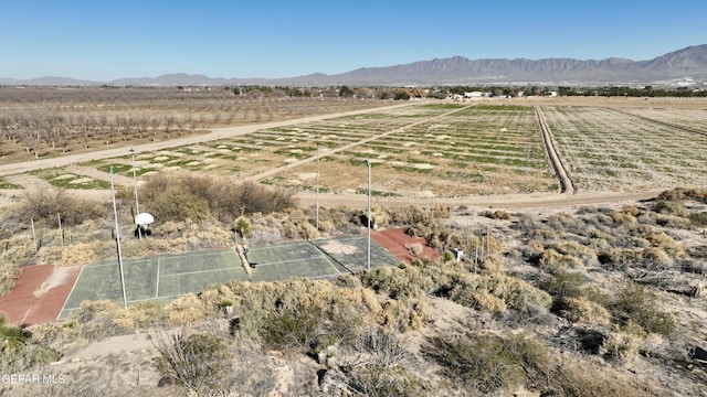 birds eye view of property with a mountain view and a rural view